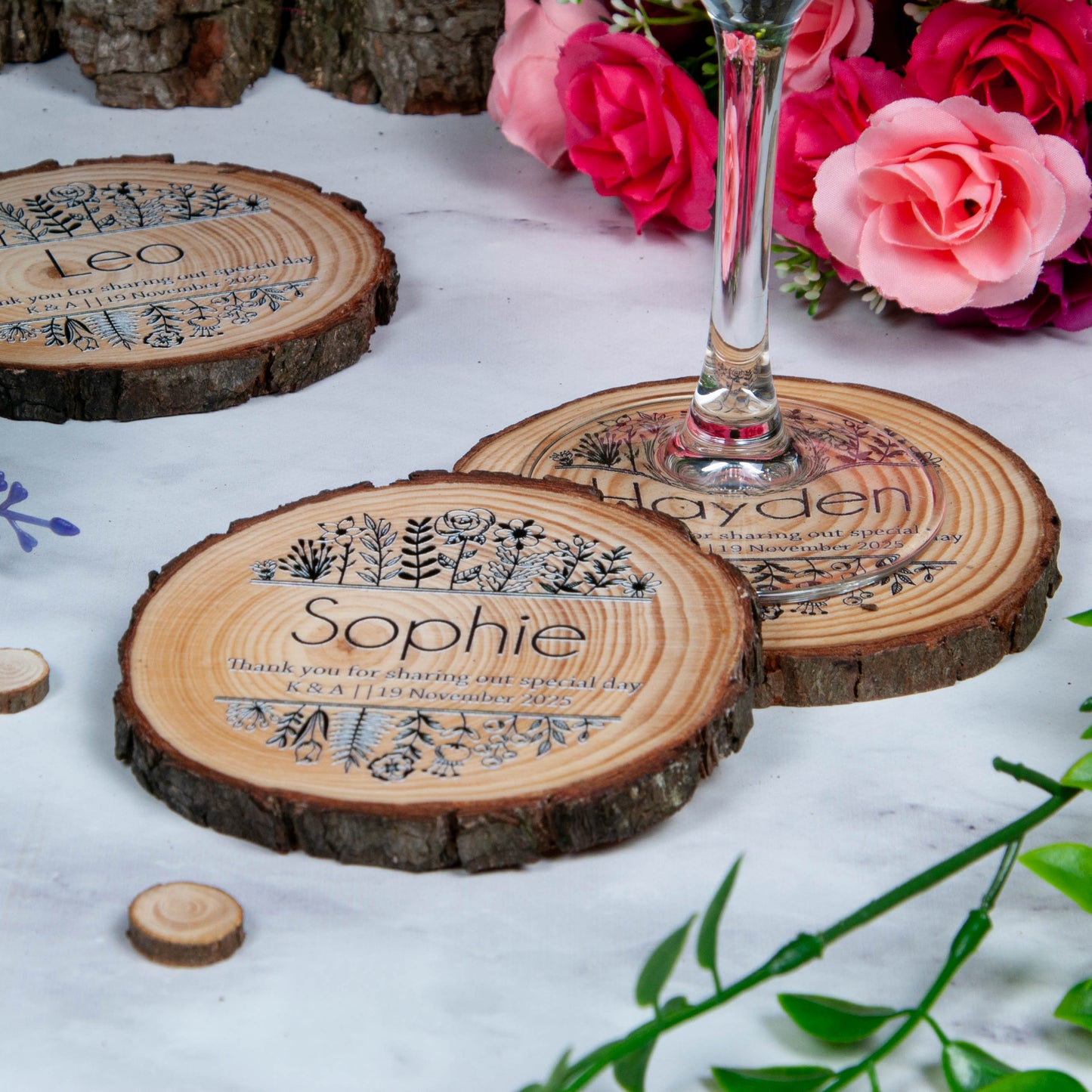 Black and white floral design on wood slice coasters