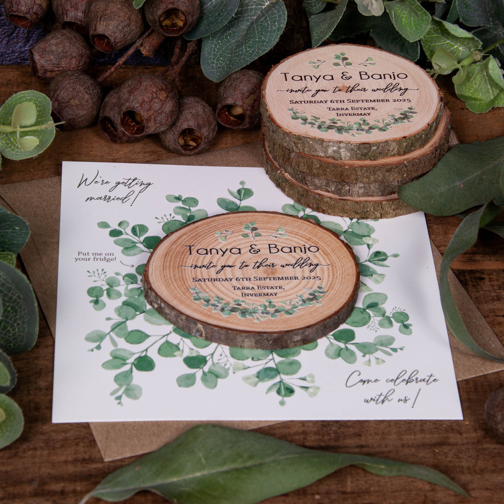 Side view of Rustic Eucalyptus-style wedding invitation showcasing wood slice with eucalyptus design and matching card.