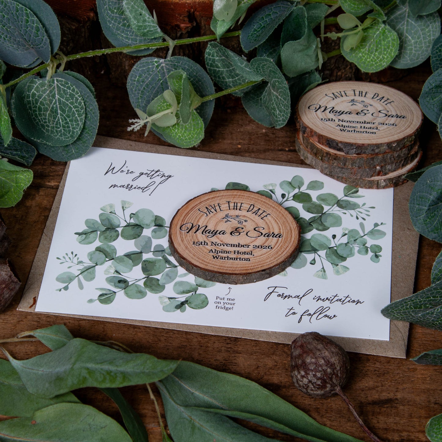 unique wood slice save the date magnet with eucalyptus design by Wedding Forest