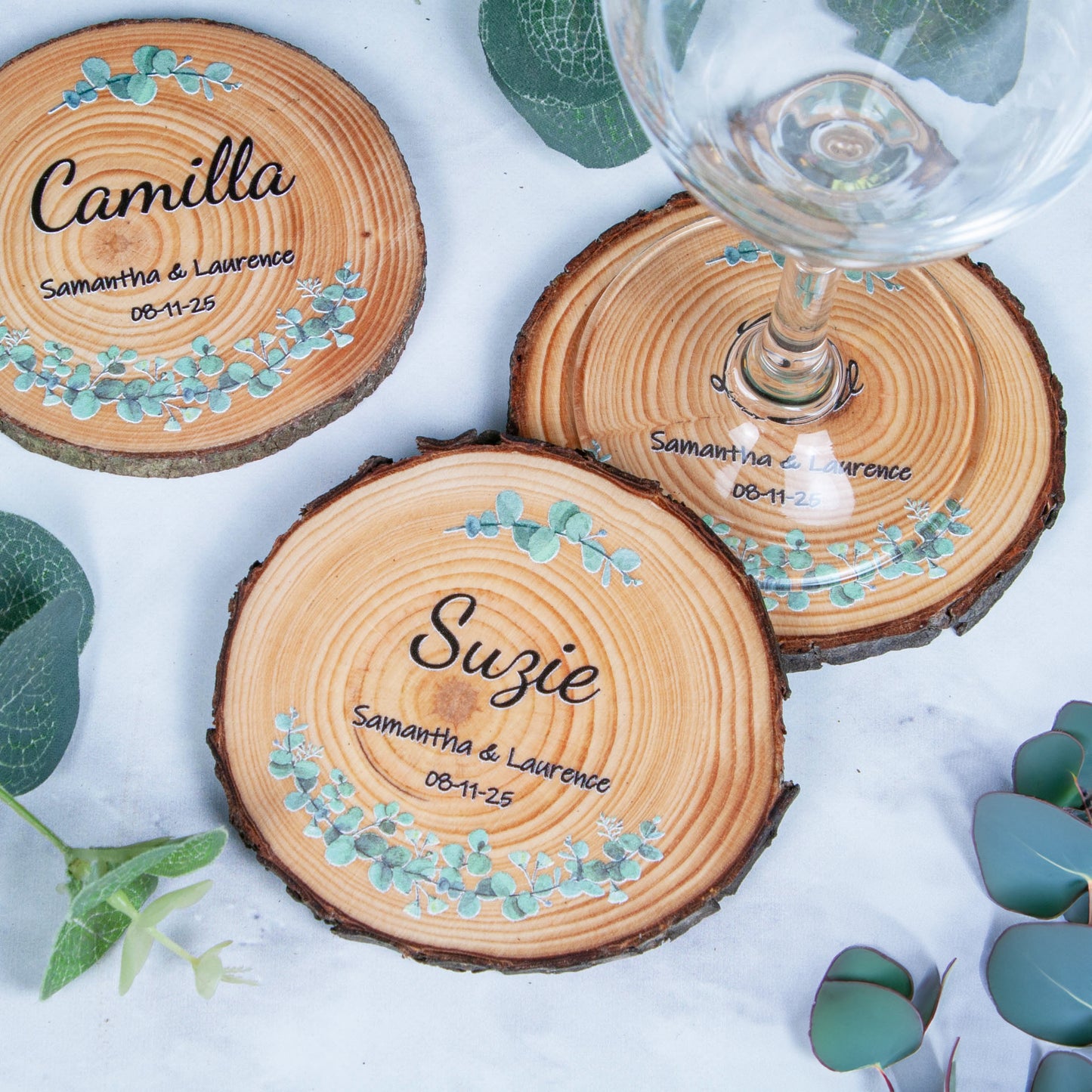 Unique wedding favour wood slice coaster with eucalyptus design