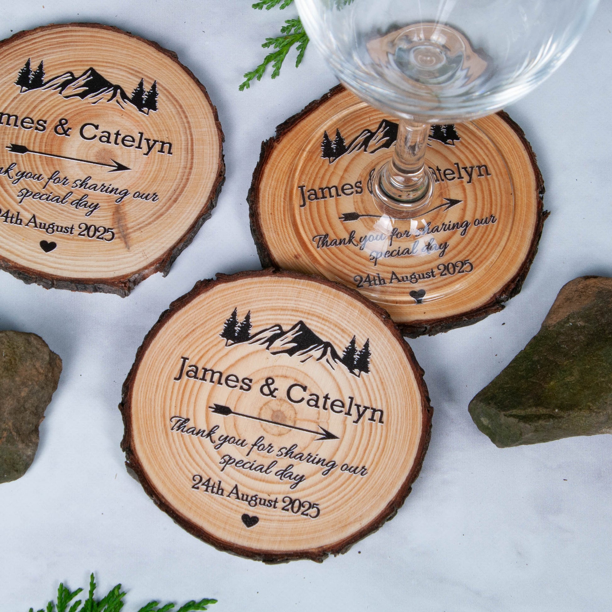 Rustic wood slice wedding favor coasters with mountain design