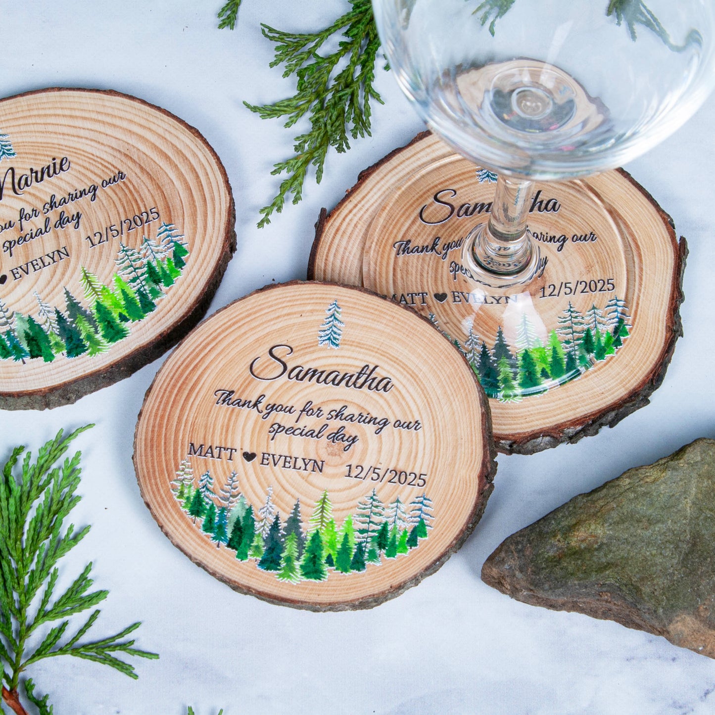 Top down view of wood slice wedding coasters with tiaga design