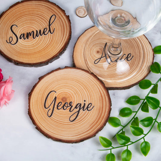 Personalised wood slice coaster placecards with guest names